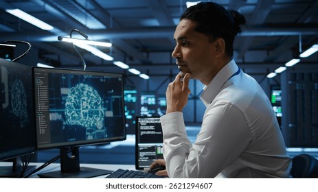 Engineer doing checkup on server hub to optimize it for data processing requirements of AI workloads. Hardworking employee inspects data center used for machine learning, camera B