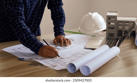 Engineer Drawing Architecture Plan And Construction Design. Design and build a new residential building - Real estate concept.