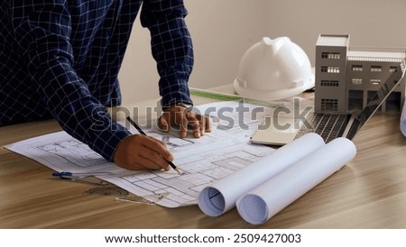 Engineer Drawing Architecture Plan And Construction Design. Design and build a new residential building - Real estate concept.