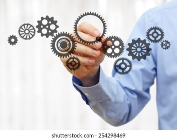 engineer draws a chain sprockets. Technology and industry concept