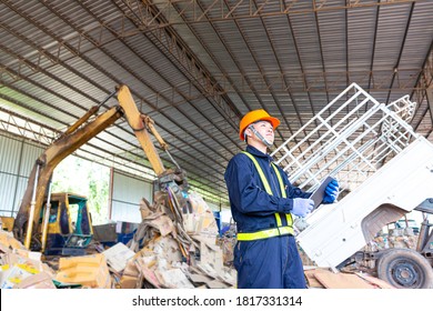 Engineer Driving A Loader In The Recycling Plant.