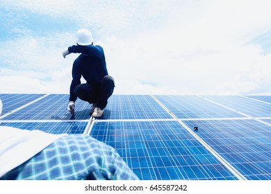 engineer and electrician team swapping and install solar panel ; electrician team checking hot spot on break panel
 - Shutterstock ID 645587242