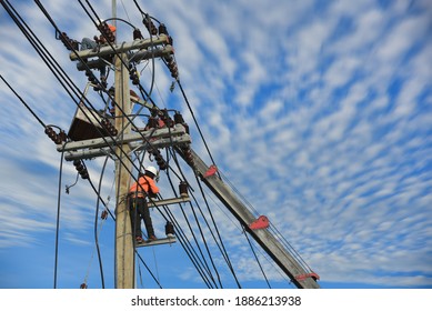 Engineer Or Electrician Working On Checking And Inspection Equip On The Electric Pole