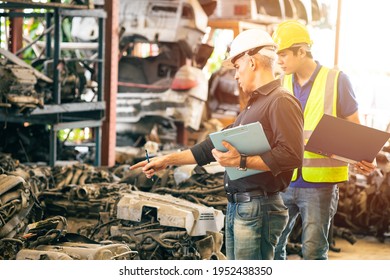 Engineer Employee Working With Manager Checking Stock Inventory In Garage Used Engine Car Part Store