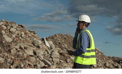 The engineer estimates the amount of construction waste removed. - Powered by Shutterstock