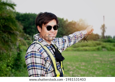 Similar – Portrait of a young man in the bamboo jungle