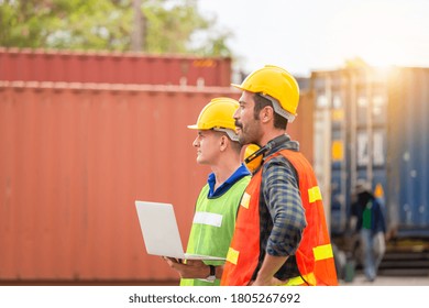 Engineer and factory worker team checking containers box from cargo with blurred background, Teamwork concept