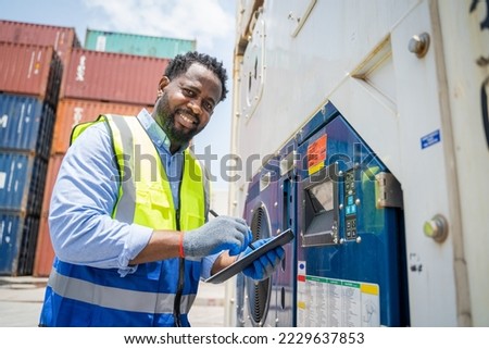 Engineer or foreman checking about shipping of container box in warehouse stock yard.