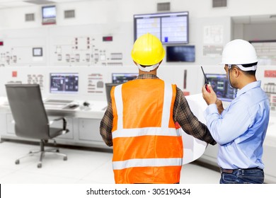 Engineer And Foreman Use Radio Communication For Command Working At Control Room Of A Modern Thermal Power Plant