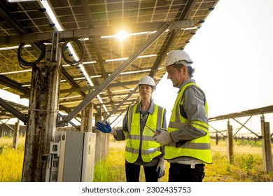 Engineer hand is installing and checking an operation of sun and cleanliness of photovoltaic solar panels, Engineer with energy measurement tool photovoltaic modules for renewable energy