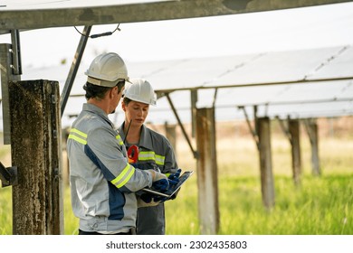 Engineer hand is installing and checking an operation of sun and cleanliness of photovoltaic solar panels, Engineer with energy measurement tool photovoltaic modules for renewable energy