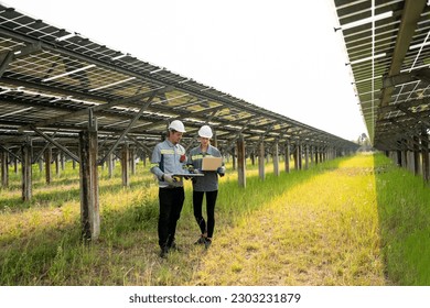Engineer hand is installing and checking an operation of sun and cleanliness of photovoltaic solar panels, Engineer with energy measurement tool photovoltaic modules for renewable energy