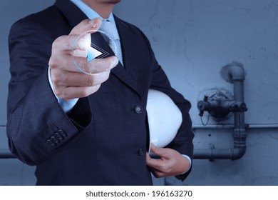 engineer hand press play button sign to start or initiate projects as concept 