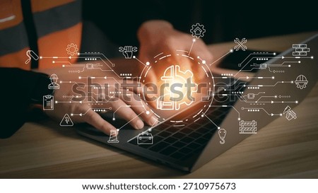 Engineer hands typing on laptop with construction management icons. Smart civil engineering technology and contractor building plan concept with digital network interface connection.