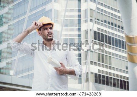 Engineer with helmet in city