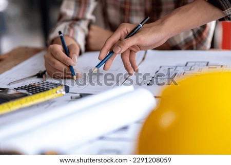 engineer are helping to design work on blueprints, engineer people meeting working and pointing at a paper, professional engineer and architect are drafting a constuction house room building