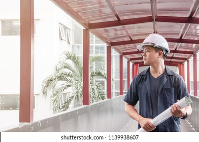 Engineer Holding A Blueprint For His Work At Link Way, Engineering Student Wear Safety Helmet, Asian Engineer Walking On Link Way, Portrait Of Young Engineer Holding Blueprint Walking On Bridge