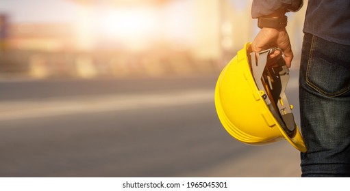 Engineer holding helmet on site Road construction For the development of modern transportation systems, Technician worker hold hard hat safety first