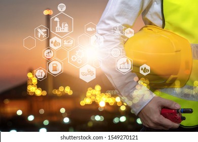 Engineer Holding Walkie Talkie Are Working Order At Oil And Gas Refinery. Industry Petrochemical Concept Image And Icon Connecting Networking Using Technology.