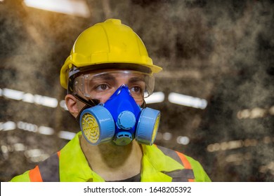 A Engineer Industry Wearing Safety Uniform ,black Gloves ,gas Mask Feel Suffocate When Under Checking Chemical Tank In Industry Factory Work.
