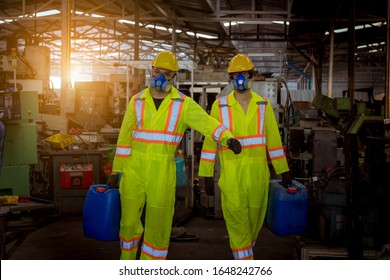 A Engineer Industry Wearing Safety Uniform ,black Gloves And Gas Mask Under Checking Chemical Tank In Industry Factory Work.