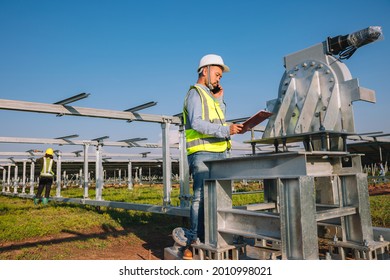 engineer inspect solar tracking machine in solar power plant; Monitor project of  automatic solar tracking