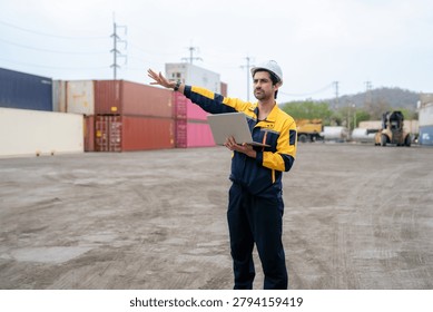 Engineer inspecting cargo containers at warehouse yard. Shipping, freight transport.