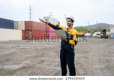 Engineer inspecting cargo containers at warehouse yard. Shipping, freight transport.