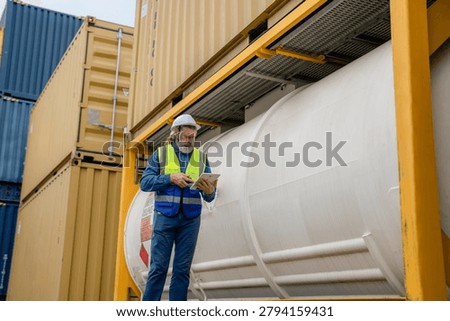 Engineer inspecting cargo containers at warehouse yard. Shipping, freight transport.