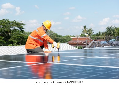 engineer inspecting solar panel installation on house roof solar panel maintenance inspector - Shutterstock ID 2163380387