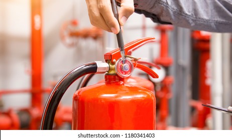 Engineer Inspection Fire Extinguisher In Control Room.