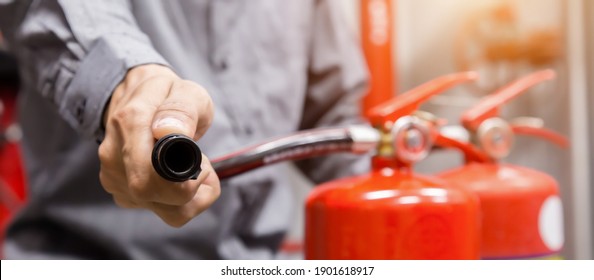 Engineer Inspection Fire Extinguisher In Control Room.