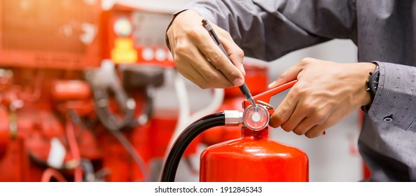 Engineer Inspection Fire Extinguisher In Control Room.