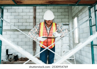 An engineer inspects construction operations and assesses the structural integrity of a house. 