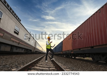 Engineer inspects container train of transport company Distribution and transportation of goods by rail A container train passing through an industrial area