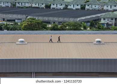 Engineer inspects the factory roof.