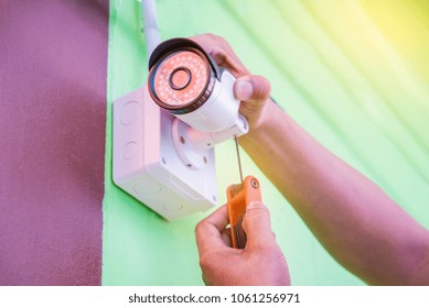 Engineer Installing Infrared CCTV Camera  Home Security System.