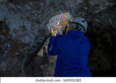 engineer looking for and analyzing the veins of a mineral