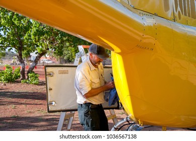 Engineer maintaining a helicopter