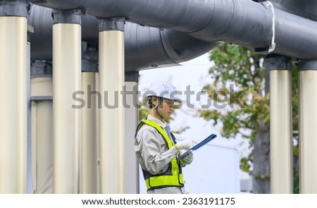 Engineer maintaining and inspecting piping equipment.