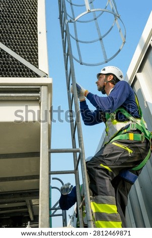 Engineer maintenance hvac cooling tower technician ladder safety rooftop industrial scene with professional climbing caged ladder for inspection and repair, focused ventilation work under clear sky