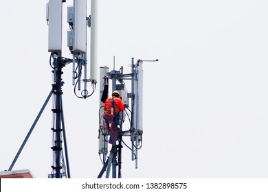 Engineer maintenance on telecommunication tower doing ordinary maintenance and control to an antenna for communication, 3G, 4G and 5G cellular. Cell Site Base Station. - Shutterstock ID 1382898575