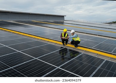 engineer maintenance solar panel, engineering service and check solar cell installing rooftop. Photovoltaic installing buildings in factory. engineer, electrician check system solar energy on rooftop.
