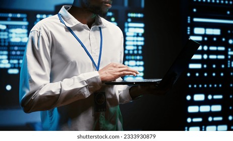 Engineer making sure servers in cloud computing business service are correctly equipped to provide redundancy, automatic failover and rapid reconfiguration of clusters to minimize failure of hardware