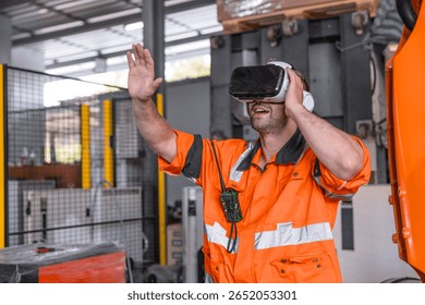 Engineer male using VR virtual reality goggle headset device to control operate robot arm in modern technology industry