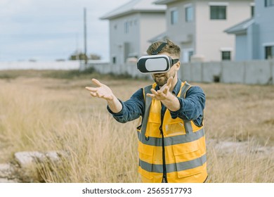 Engineer male worker using Visual reality VR or Augmented reality AR technology in construction industry. Modern digital innovation in engineering concept.