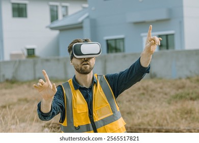 Engineer male worker using Visual reality VR or Augmented reality AR technology in construction industry. Modern digital innovation in engineering concept.