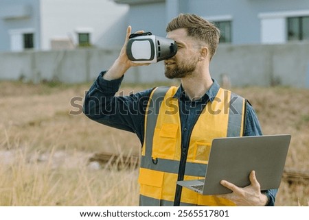 Engineer male worker using Visual reality VR or Augmented reality AR technology in construction industry. Modern digital innovation in engineering concept.