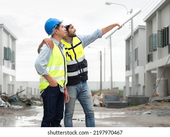 Engineer Man And Architect, Contractor Wear Safety Helmets Discuss Housing Development Project At Construction Site As On Blueprint. Contractor Manager Inspecting House Building Estate Infrastructure