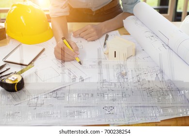 Engineer man and Architect drawings blueprint  at Construction Site.Home Project to Offer Management - Shutterstock ID 700238254